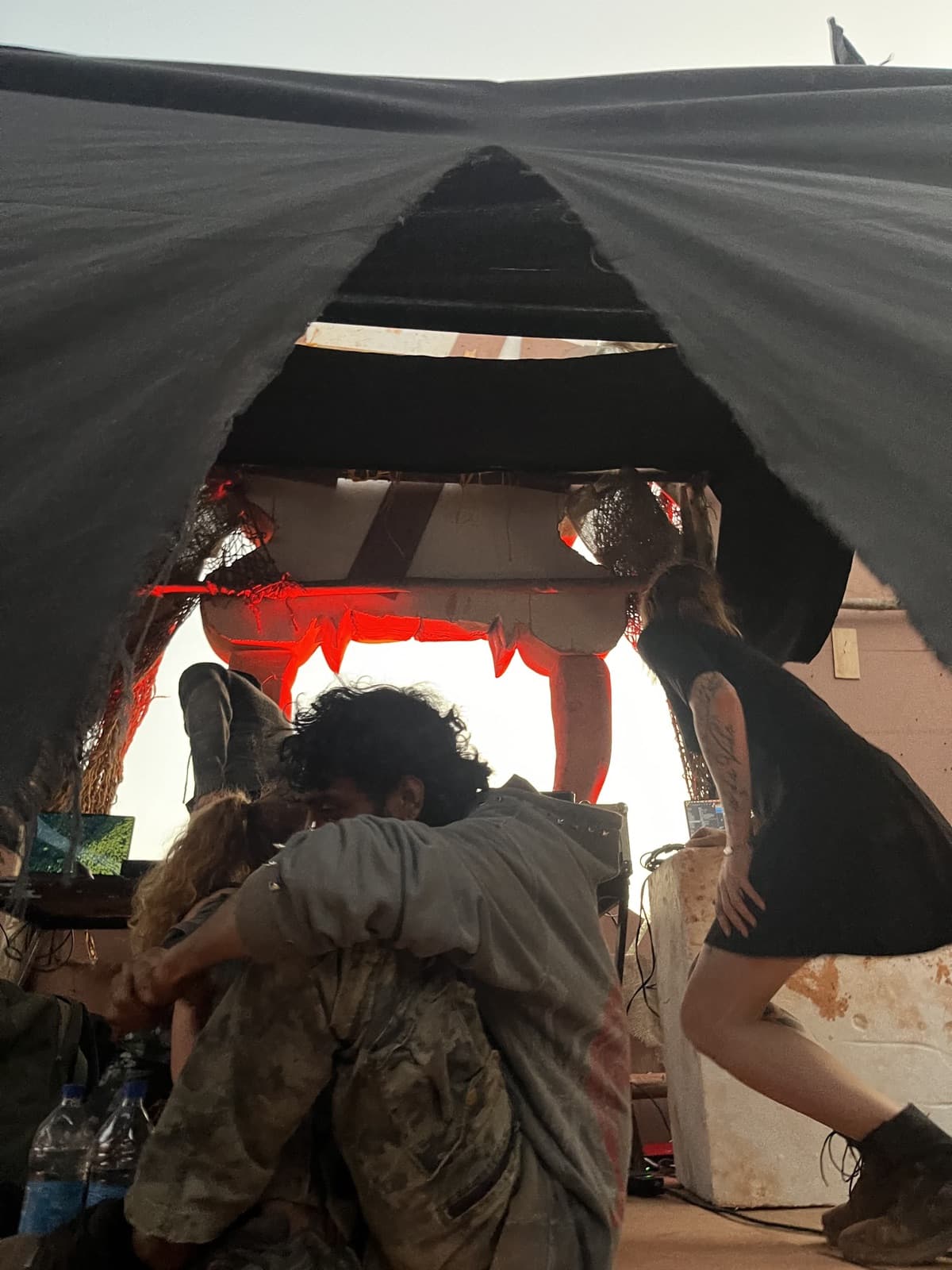 Inside the draped booth at dusk