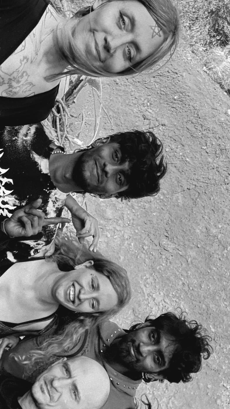 The crew on the dirt in black and white