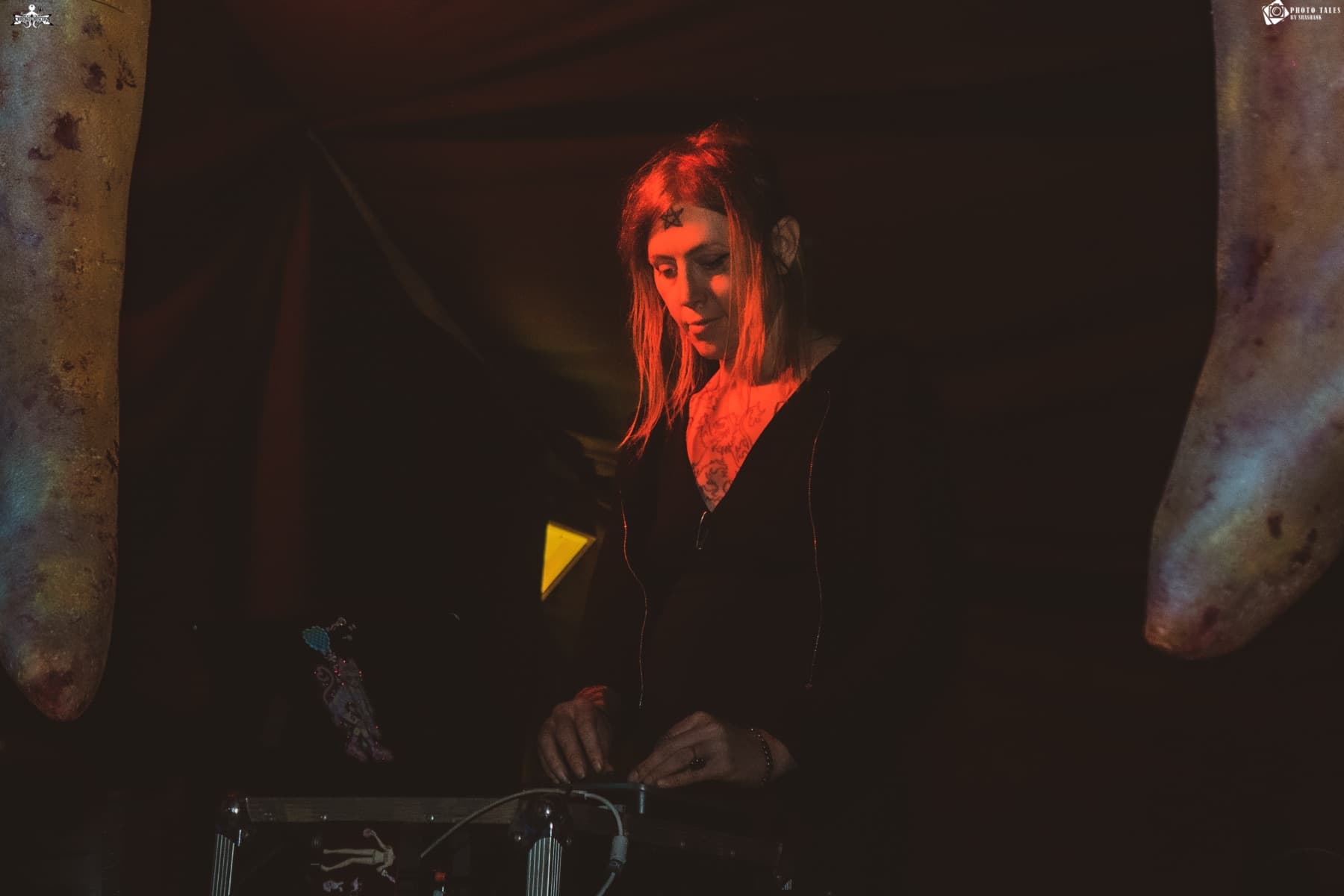 Performer at the decks in red light